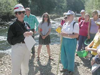 Photo of Mamie Brouwer, project manager, speaking with local boaters