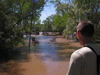tom at the flooded memorial park below ww park