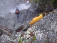 Lowering boats down the river right cliff at the Falls