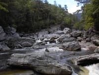 Looking up at the clapper rapid below Cave Falls
