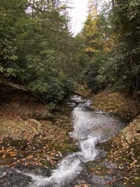 Looking down bedrock at final drop of Swimming hole Falls