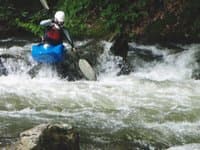 Boof on rapid above first bridge