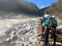 The team scouts the new rapid at Quarter mile