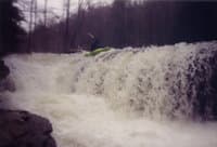 Adam Thomas at the top of Friendly Falls