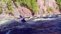 Karen Frank punching at big wave on the Montreal at 720cfs