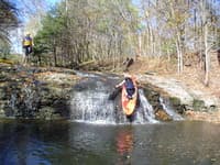 Clint dropping over the edge of the falls, low water