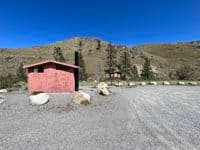 Restroom and parking at river access about 1/2 mile downstream of Burma Road bridge.