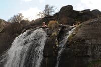Looking up at the hot spring from river level.