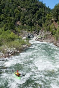 Kayaker Merlin Hanauer paddling the Butler Ledge Rapid