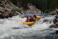 Aki Guides the Raft Through Howard's Plunge