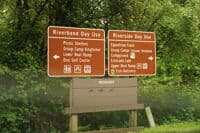 Sign Near Entrance Providing Direction to River Access