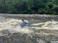 Trip dropping into the rooster tail wave