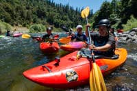 In the eddy at the surf wave above Rock Creek