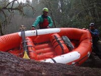 Portaging a raft at the log jam